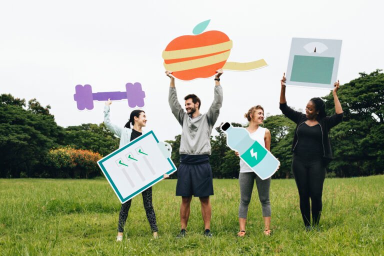Happy diverse people working out in the park